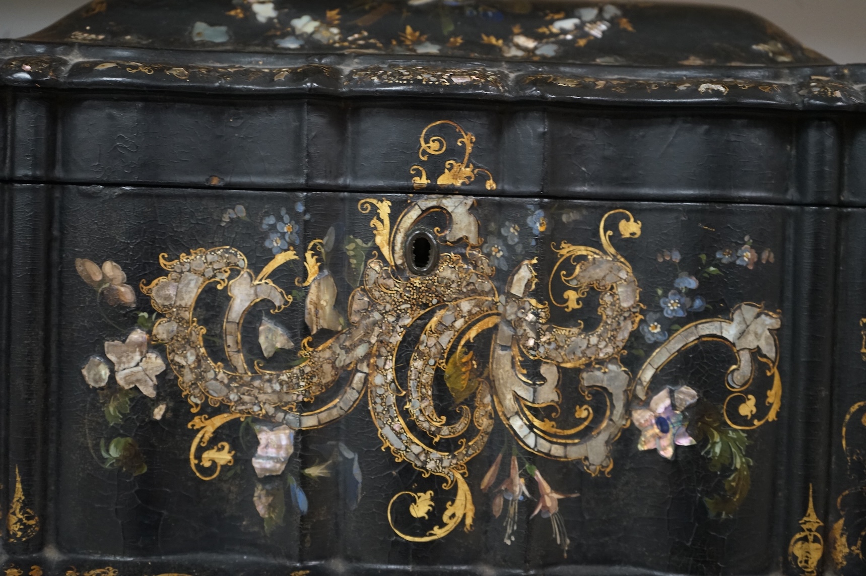 A large Victorian Papier maché and mother-of-pearl tea caddy, 32cm wide, and a Sorrento ware marquetry tea caddy, 19.5cm wide.